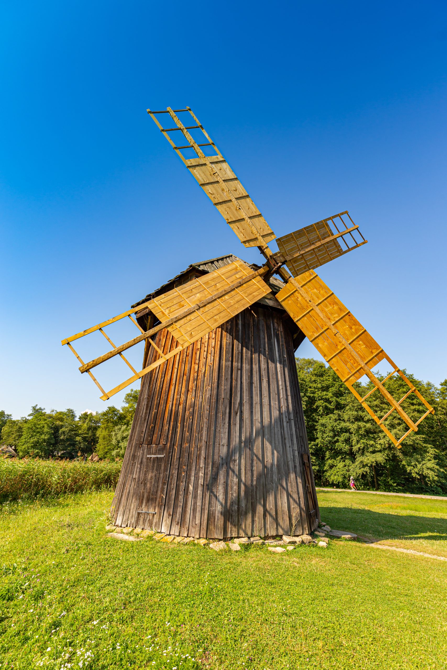 Wooden windmill. Sunny summer day at the windmill village countryside
